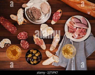 Charcuterie Board with Bread and White Wine Stock Photo