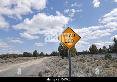 A dead end roadsign on a country gravel road in the Oregon Outback near Fort Rock, Oregon. Stock Photo