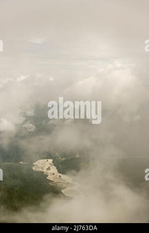 The dry course of the Rissbach meanders through the fog, seen from the Vorderskopf. Stock Photo
