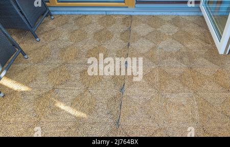 Close up view of carpeting on terrace in front of entrance to house. Sweden. Stock Photo