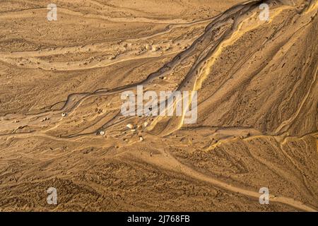 Molds and flotsam on the beach of Walchensee after a heavy thunderstorm Stock Photo