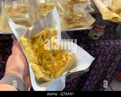 Roti with baby banana filling, typical Thai dessert, Asiatique The Riverfront, entertainment mile, night market, Chao Praya river, Bangkok, Thailand, Asia Stock Photo