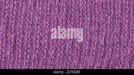 Magneta knitted background with copy space. Fabric purple lavender colored colored texture for background and design. Stock Photo