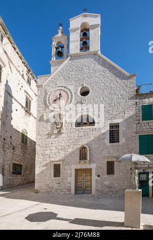 Iron statue of a little boy with umbrella in front of the church and church museum of St. Barbara in the old town of Sibenik, Sibenik-Knin County, Croatia, Europe Stock Photo