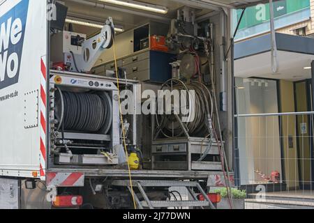 Lubeck, Germany, May 4, 2022: Truck with equipment for sewer works such as hoses, pneumatic pumping unit, cables and machines, professional technology Stock Photo