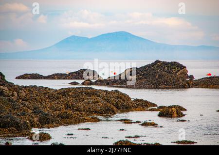 Anglesey through sea mist from Rhoscolyn - Borth Wen Beach - North Wales Stock Photo
