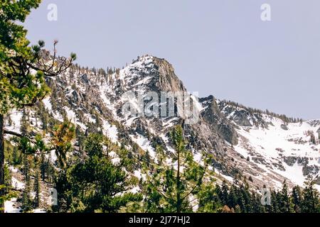 Mountain with a snow and pine trees, views near Lake Tahoe in the spring Stock Photo