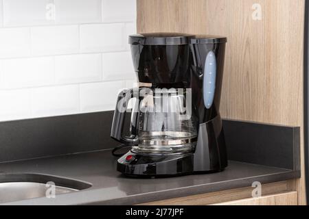 A Electric Coffee maker Black In The Kitchen Stock Photo