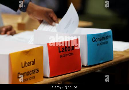 (220507) -- LONDON, May 7, 2022 (Xinhua) -- Staff count ballots for the local elections at Wandsworth, London, Britain, May 6, 2022. The United Kingdom's (UK) ruling Conservative Party lost some of its traditional strongholds in Thursday's local elections. TO GO WITH 'Roundup: UK Conservatives suffer losses in local elections amid partygate scandal, inflation' (Xinhua/Li Ying) Stock Photo