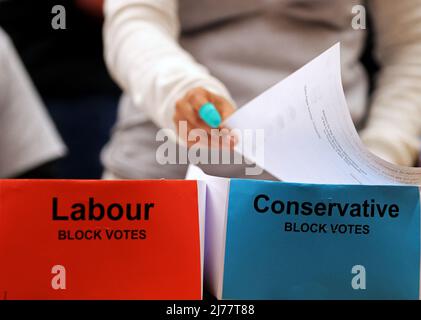 (220507) -- LONDON, May 7, 2022 (Xinhua) -- Staff count ballots for the local elections at Wandsworth, London, Britain, May 6, 2022. The United Kingdom's (UK) ruling Conservative Party lost some of its traditional strongholds in Thursday's local elections. TO GO WITH 'Roundup: UK Conservatives suffer losses in local elections amid partygate scandal, inflation' (Xinhua/Li Ying) Stock Photo