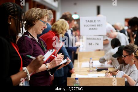 (220507) -- LONDON, May 7, 2022 (Xinhua) -- Staff count ballots for the local elections at Wandsworth, London, Britain, May 6, 2022. The United Kingdom's (UK) ruling Conservative Party lost some of its traditional strongholds in Thursday's local elections. TO GO WITH 'Roundup: UK Conservatives suffer losses in local elections amid partygate scandal, inflation' (Xinhua/Li Ying) Stock Photo