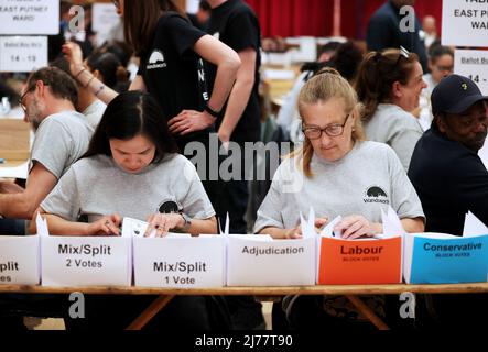 (220507) -- LONDON, May 7, 2022 (Xinhua) -- Staff count ballots for the local elections at Wandsworth, London, Britain, May 6, 2022. The United Kingdom's (UK) ruling Conservative Party lost some of its traditional strongholds in Thursday's local elections. TO GO WITH 'Roundup: UK Conservatives suffer losses in local elections amid partygate scandal, inflation' (Xinhua/Li Ying) Stock Photo