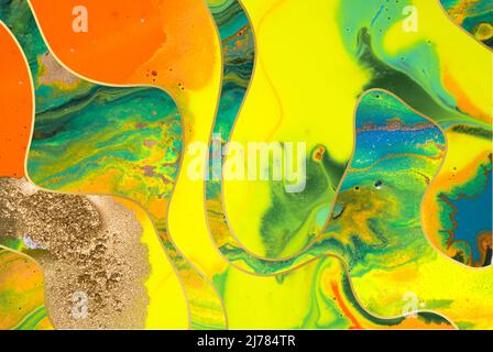 Gold dust and waves with fluorescent inks background. Yellow marble template Stock Photo