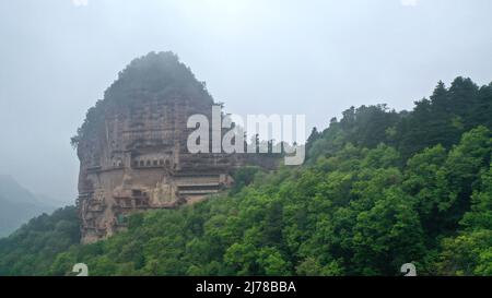 (220507) -- TIANSHUI, May 7, 2022 (Xinhua) -- Aerial photo taken on April 29, 2022 shows a view of the Maiji Mountain Grottoes in Tianshui, northwest China's Gansu Province. The Maiji Mountain Grottoes is one of the four most famous grottoes in China. (Xinhua/Chen Bin) Stock Photo