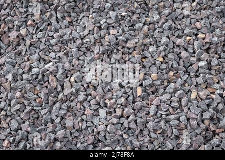 Crushed rock close up. Stone road building material gravel texture, background Stock Photo