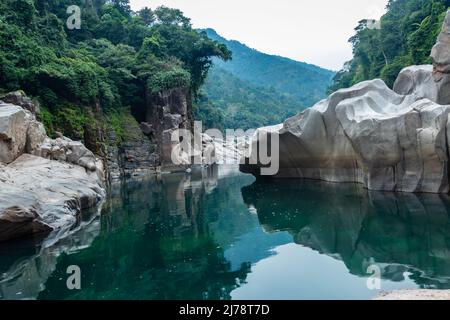 river water with naturally formed white shiny stone in unique shape at dry river bed at morning image is taken at Sliang wah Umngot amkoi jaintia hill Stock Photo