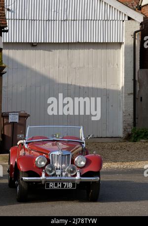 vintage MG TF  sports car parked in front of no parking sign Stock Photo