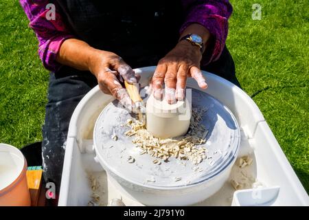 Partial view of lady making pottery at Living Crafts Fair Hatfield House, Hertfordshire UK Stock Photo