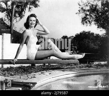 DOROTHY MALONE  in 1947 posing on Diving Board in Swimsuit publicity for Warner Bros. Stock Photo