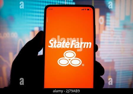 In this photo illustration, the State Farm Insurance logo seen displayed on a smartphone. (Photo by Rafael Henrique / SOPA Images/Sipa USA) Stock Photo