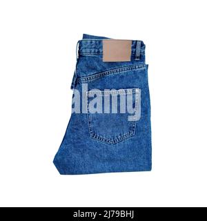 Blue folded denim jeans isolated on white background. Stock Photo