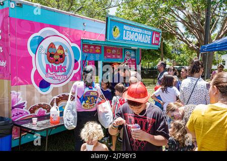 Miami Beach Florida Annual Miami Beach Police Block Party family free event Flamingo Park fresh squeezed lemonade stand busy line queue Stock Photo