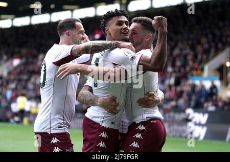 Aston Villa's Ollie Watkins (centre) celebrates scoring their side's third goal of the game with team-mates during the Premier League match at Turf Moor, Burnley. Picture date: Saturday May 7, 2022. Stock Photo