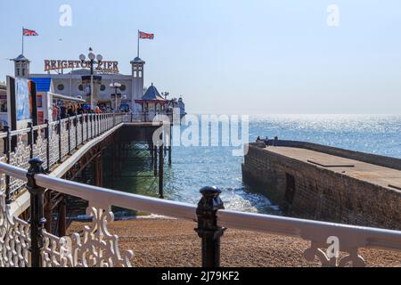 BRIGHTON, GREAT BRITAIN - SEPTEMBER 16, 2014: This is a view of the Brighton Pier and the English Channel from the coast. Stock Photo
