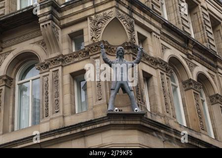 LIVERPOOL, GREAT BRITAIN - SEPTEMBER 13, 2014: This is a sculpture of Ringo Starr on the eaves of one of the houses of the Beatles' homeland. Stock Photo