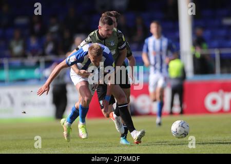 HARTLEPOOL, UK. MAY 7TH Hartlepool United's Marcus Carver battles with Colchester's Tommy Smith during the Sky Bet League 2 match between Hartlepool United and Colchester United at Victoria Park, Hartlepool on Saturday 7th May 2022. (Credit: Mark Fletcher | MI News) Credit: MI News & Sport /Alamy Live News Stock Photo