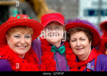 Women of the Red Hat Society celebrate on St. Patrick's' day in the USA, face Stock Photo