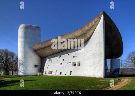 The Chapel Notre-Dame-du-Haut bears the sign of its famous architect, Le Corbusier. High on a hill above the village of Ronchamp close to the city of Stock Photo