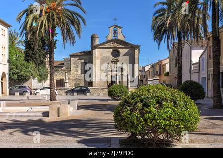 Penitents Gris Chapel in Place de la Viguerie inside the walled city of Aigues-Mortes in the Petite Camargue, Occitanie Region of France. Stock Photo