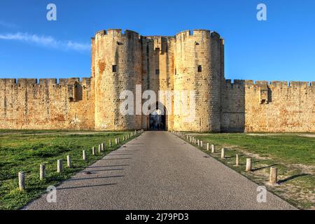 The beautiful preserved Mills Gate of the walled city of Aigues-Mortes in the Petite Camargue, Occitanie Region of France during the golden hour. Stock Photo