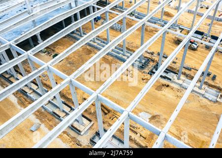 Factory Building. Aerial Industrial Construction Site with Crane and Construction Equipment. Stock Photo