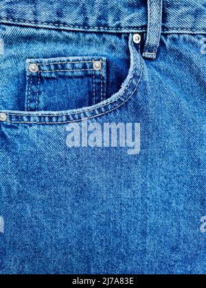 Blue denim Jeans pocket with revits texture background.  Stock Photo