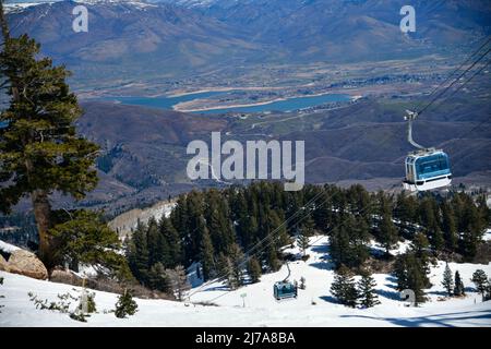 Gondola lift going up at the Snowbasin Ski Resort in Utah. Breathtaking view to the valley. Stock Photo