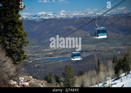 Gondola lift going up at the Snowbasin Ski Resort in Utah. Breathtaking view to the valley. Stock Photo