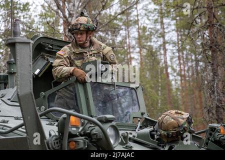 Niinisalo, Finland. 03 May, 2022. U.S. Army Spc. James Dudgeon prepares his Stryker Infantry fighting vehicle during simulated combat exercises Arrow 22 at the Niinisalo Training Area, May 3, 2022 in Niinisalo, Finland. The annual Finnish military exercise included the United States, Estonia, Lativia, and the United Kingdom.  Credit: Spc. Elizabeth MacPherson/U.S Army/Alamy Live News Stock Photo