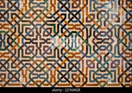 Ornamental medieval ceramic tiles of walls in Nasrid Palaces in the