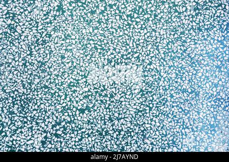 Fragment of a ceramic floor with green stones. texture background. texture with colorful spots, for add text or work design for backdrop product. top Stock Photo