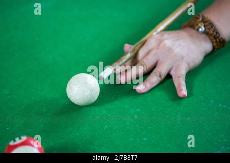 Close-up of a pool player playing pool Stock Photo