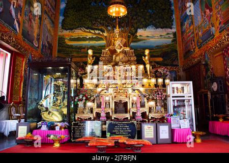 Ancient buddha statues in old ubosot church for thai people travelers visit and respect praying blessing holy worship at Wat Chomphuwek or Chumpoo Wek Stock Photo