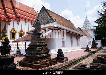 Ancient old ordination hall or antique ubosot church and ruins stupa chedi for thai people visit respect praying blessing holy worship at Wat Chomphuw Stock Photo