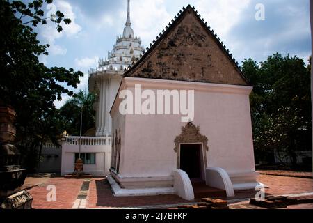 Ancient old ordination hall or antique ubosot church and ruins stupa chedi for thai people visit respect praying blessing holy worship at Wat Chomphuw Stock Photo