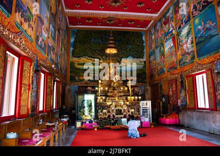 Ancient buddha statues in old ubosot church for thai people travelers visit and respect praying blessing holy worship at Wat Chomphuwek or Chumpoo Wek Stock Photo