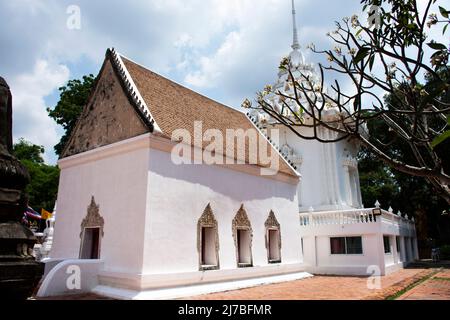 Ancient old ordination hall or antique ubosot church and ruins stupa chedi for thai people visit respect praying blessing holy worship at Wat Chomphuw Stock Photo