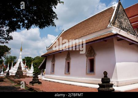 Ancient old ordination hall or antique ubosot church and ruins stupa chedi for thai people visit respect praying blessing holy worship at Wat Chomphuw Stock Photo