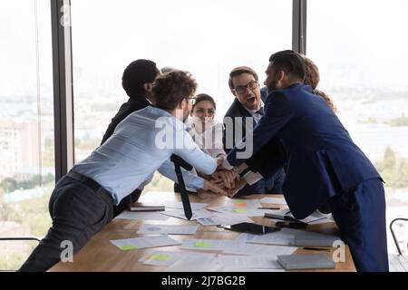 Excited happy business teammates celebrating success, team achieve Stock Photo