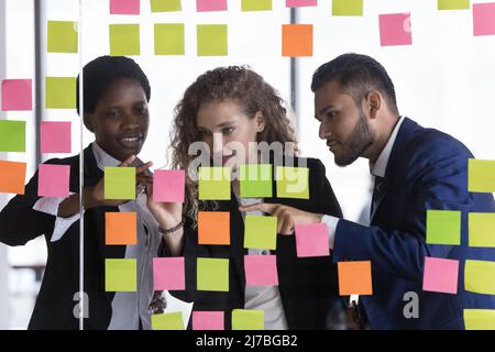Motivated diverse business team planning project tasks Stock Photo